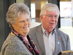 Thea deGroot smiles as she accepts her peace medallion award from YMCAs across Southwestern Ontario board member Kirk Wilson. deGroot was one of four people honoured with a medallion in Sarnia Monday, recognizing individual and group efforts to build community and peace. Tyler Kula/Sarnia Observer/Postmedia Network