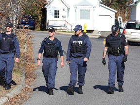 John Lappa/Sudbury Star
Greater Sudbury Police canvass the Melvin Avenue neighbourhood after 51-year-old resident Marcel Couillard was found dead in this file photo. Reginald Berard, 23, of the Whitefish Lake First Nation, has since been charged with second-degree murder.