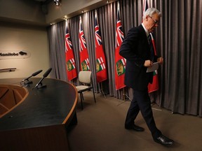Manitoba Premier Greg Selinger leaves a press conference regarding the Speech from the Throne at the Manitoba Legislature in Winnipeg, Monday, Nov. 16, 2015. THE CANADIAN PRESS/John Woods