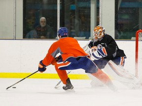 Cam Talbot stops Darnell Nurse during practice at the Clareview Recreation Centre on Monday. (Ian Kucerak, Edmonton Sun)