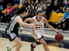 Regiopolis-Notre Dame Panthers' Rebecca Wendland drives past Holy Cross Crusaders' Sydney Gauthier during the Kingston Area Secondary Schools Athletic Association senior girls basketball final at the Queen's Athletics and Recreation Centre on Monday night. (Ian MacAlpine /The  Whig-Standard)