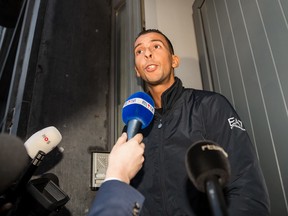 Mohamed Abdeslam addresses the media at his house in the Molenbeek neighborhood in Brussels on Monday, Nov. 16, 2015. After his weekend detention, Mohamed Abdeslam was released by police, and spoke to reporters about his brother Brahim who died during a suicide attack Friday and his other brother Salah who is a fugitive, following terror attacks in Paris. (AP Photo/Leila Khemissi)