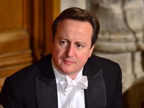 Britain's Prime Minister David Cameron attends the Lord Mayor's Banquet, at the Guildhall, in central London, Monday Nov. 16, 2015. In his high profile speech Cameron said Britain must show the same resolve it displayed against Hitler during the Blitz in order to defeat the threat of terrorism, announcing plans for a significant boost in spending on special forces. (Dominic Lipinski/PA via AP)