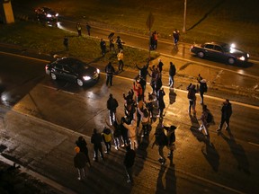Marchers stop traffic on an entrance ramp to westbound Interstate 94 before moving to the main freeway on Nov. 16, 2015, in Minneapolis. (Jeff Wheeler/Star Tribune via AP)