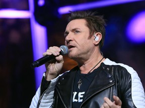 British singer Simon Le Bon performs during a 24-hour live webcast from the foot of the Eiffel Tower, in Paris, Friday, Nov. 13, 2015. Former U.S. Vice President Al Gore, who helped negotiate the 1997 climate treaty that failed to control global warming, will host the round-the-clock event that includes musical performances by Elton John, Duran Duran and others. Other concerts will be broadcast from locations around the globe, from Rio de Janeiro to Miami, Sydney and Cape Town. (AP Photo/Thibault Camus)