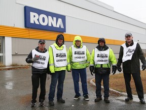 Fourteen members of United Food and Commercial Workers Local 175, who work at Rona on Barrydowne Road in Sudbury, Ont., walk a picket line after being locked out by their employer on Thursday November 12, 2015 at 12:01 a.m. John Lappa/Sudbury Star