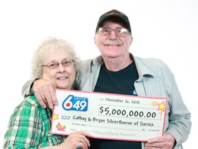 Cathay and Bryan Silverthorne show off their $5-million cheque at the Ontario Lottery and Gaming Corporation’s lottery centre in Toronto. The Sarnia couple’s financial windfall was announced Tuesday morning. Submitted photo