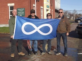 Members of the Northern Lights Métis Council were on hand to raise the flag at the town hall. Denis Beaulne (left to right), Urgel Courville, Susan Skidmore, and Aurel Courville.