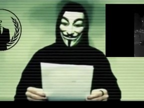 A man wearing a mask associated with Anonymous makes a statement in this still image from a video released on social media on Nov. 16, 2015. REUTERS/Social Media Website via Reuters TV