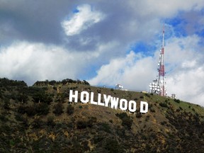 The Hollywood sign is shown in Hollywood, California in this December 13, 2009 file photo. Hollywood has not meaningfully increased the number of minority characters on the big screen and Hispanics were the most underrepresented in films, a study released on August 4, 2014 said. REUTERS/Fred Prouser/Files