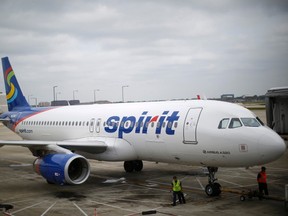 A Spirit Airlines airplane sits at a gate at the O'Hare Airport in Chicago, Illinois October 2, 2014. REUTERS/Jim Young