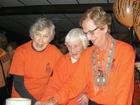 Photo submitted by Theresa Taylor
Dorothy Davies-Flindall, Win Perryman and Bernice Hassay as they cut the celebration cake during the Quinte Grannies for Africa nine year anniversary celebration Nov. 9.