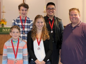 Submitted photo
Shown here are local students, in back, Alexander Kohlsmith and Derrick Ho and in front Andrew Powell, Natasha Mullins with their awards from the 2015 Conservatory Canada Convocation on Nov. 14. Shown at right is music teacher Michael Faulkner. Not pictured is Amy Park.