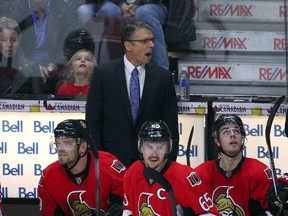 Ottawa Senators head coach Dave Cameron talks to the players during an overtime period against Detroit Red Wings at Canadian Tire Centre. Mandatory Credit: Jean-Yves Ahern-USA TODAY Sports
