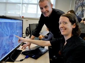 Gordon Osinski, director of the Centre for Planetary Science and Exploration at Western University (left), and Western PhD candidate Jennifer Newman, take part in a Mars rover simulation exercise in London Ont. November 17, 2015. CHRIS MONTANINI\LONDONER\POSTMEDIA NETWORK