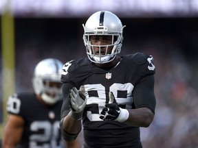 Outside linebacker Aldon Smith of the Oakland Raiders celebrates in the third quarter against the Minnesota Vikings at O.co Coliseum in Oakland on Nov. 15, 2015. (Thearon W. Henderson/Getty Images/AFP)