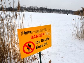 A sign warns about going on Grenadier Pond in Toronto on Feb. 18, 2015. (Toronto Sun)