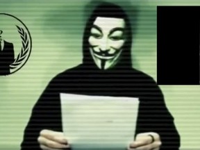 A man wearing a mask associated with Anonymous makes a statement saying the activist hackers known for cyber attacks on government, corporate and religious websites, is preparing to unleash waves of cyberattacks on Islamic State following the attacks in Paris last week that killed 129 people. REUTERS/Social Media Website