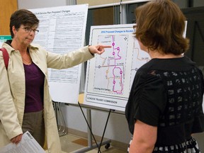 Helen Rodowa talks to Katie Burns, LTC manager of planning services, at Jalna Library branch in London on Tuesday. Rodowa isn?t happy with the proposed changes to bus routes through the White Oaks area of London. Mike Hensen / The London Free Press