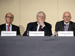 From left: Barrister & Solicitor Richard McLaren, former World Anti-Doping Agency (WADA) President and chairman of the WADA independent commission Richard W Pound, and Head of Department Cybercrime with Bavarian Landeskriminalamt (LKA) Guenter Younger are pictured during the presentation before the press of a report on corruption and money-laundering within international athletics on November 9, 2015 in Geneva. Just 270 days out from the start of the 2016 Rio Olympics, an independent commission set up by the WADA released its findings into a scandal already viewed as more damaging than the corruption crisis engulfing world football governing body FIFA. WADA wants lifetime bans for 5 Russian athletes, including 800m Olympic