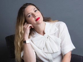 In this Oct. 20, 2015 photo, Drew Barrymore poses for a portrait to promote her new book "Wildflower," in New York.  (Amy Sussman/Invision/AP)