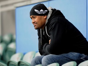 This file photo taken on October 19, 2011 shows All Blacks great Jonah Lomu watching an Australian Wallabies training session at North Harbour Stadium near Auckland during the 2011 Rugby World Cup. (AFP PHOTO/FILE/Greg WOOD)
