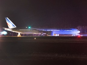 An Air France jet sits on the runway at Halifax Stanfield International Airport near Halifax, N.S. on Wednesday, Nov. 18, 2015. The aircraft, Air France Flight 055, was on its way from Washington, D.C. to Paris when it made the emergency landing after the airline received anonymous threats. THE CANADIAN PRESS/Andrew Vaughan