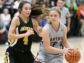 Wallaceburg Tartans' Jaimi Chauvin (3) is guarded by General Amherst Bulldogs' Grace Clifford (4) in the third quarter of the SWOSSAA senior girls 'AA' basketball final Tuesday at Wallaceburg District Secondary School. (MARK MALONE/The Daily News)