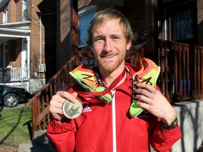 Rob Asselstine, the Ontario Colleges Athletic Association and Canadian Colleges Athletic Association cross country champion outside his home on Aberdeen Street in Kingston on Monday November 16 2015. Patrick Kennedy /The Kingston Whig-Standard/Postmedia Network