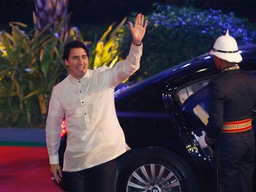 Prime Minister Justin Trudeau waves as he arrives for a welcome dinner at the Asia-Pacific Economic Co-operation (APEC) summit in Manila, Philippines, on Nov. 18, 2015. (Edgar Su/Pool Photo via AP)