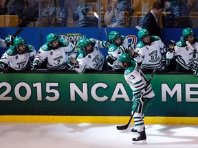 University of North Dakota forward Connor Gaarder (13) skates past the bench after scoring against the Boston University Terriers during the semifinal in the Frozen Four tournament at TD Garden. (Greg M. Cooper/USA TODAY Sports)