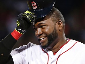 In this Aug. 20, 2014,  file photo, Boston Red Sox designated hitter David Ortiz tips his cap during a game against the Los Angeles Angels at Fenway Park in Boston. (AP Photo/Elise Amendola, File)