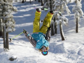 In this Nov. 10, 2015 file photo, a skier goes head over heals while doing a flip at Boreal Mountain Resort near Donner Summit, Calif. With a number of California ski resorts open already, forecasters are hoping that a strong El Nino winter will bring above-average precipitation to California this season after several years of dismal snowfall. (AP Photo/Rich Pedroncelli, File)