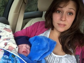 This photo taken Saturday, Nov. 14, 2015 and provided by Courtney Benavidez, Benavidez takes a selfie while holding her newborn after giving birth in a car on the side of the road near Bisbee, Ariz. Benavidez’ grandmother was rushing her to the hospital after she went into labour but the baby couldn’t wait. The grandmother pulled over behind a state trooper who had just stopped a speeding driver and sought his help. (Courtney Benavidez via AP)