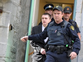 JASON MILLER/INTELLIGENCER FILE PHOTO
Convicted killer, Dean Brown, is escorted away by police after being sentenced to life in prison on Friday Oct. 21, 2011.