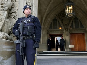 RCMP officers patrol Parliament Hill in Ottawa Ontario Wednesday Nov 18, 2015. Tony Caldwell/Ottawa Sun/Postmedia Network
