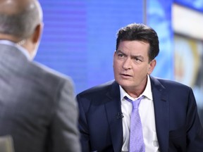 Charlie Sheen listens during an interview with host Matt Lauer on the set of NBC's "Today" show in Manhattan, New York, November 17, 2015. The former "Two and A Half Men" star said on Tuesday he is HIV positive. REUTERS/Peter Kramer/NBC