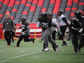 Ottawa RedBlacks defensive tackle Moton Hopkins (95) chases down a player during practice Wednesday at TD Place. TIM BAINES/OTTAWA SUN