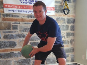 The inverted BOSU medicine ball wood chopper is an advanced balance training exericise. (Supplied photo)