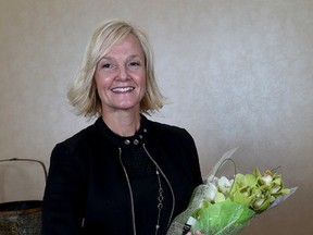 Tracie Smith-Beyak of Conquer Training and Education, winner of the cover feature award after the Kingston Whig-Standard Women in Business luncheon at the Residence Inn by Marriot Hotel Kingston Water's Edge on Wednesday November 18 2015. Ian MacAlpine /The Kingston Whig-Standard/Postmedia Network