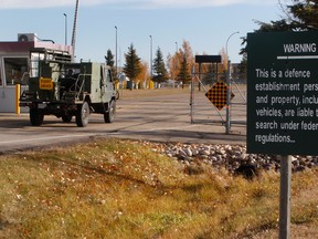 A military vehicle driven by a student driver enters CFB Edmonton on Wednesday, Oct. 22, 2014. The defence department has confirmed Canadian Forces bases across the country, including CFB Edmonton, are gearing up to house Syrian refugees. Tom Braid/Edmonton Sun/Postmedia Network