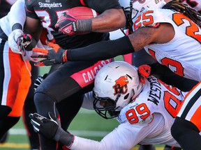 Jerome Messam shows some of the form that earned him top Cnaadian honours in 2011 during Sunday's semifinal against B.C. (Al Charest, Postmedia Network)