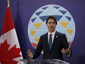 Canadian Prime Minister Justin Trudeau gestures as he speaks during a news conference after attending the 21-member Asia-Pacific Economic Cooperation (APEC) Summit in Manila November 19, 2015.  REUTERS/Erik De Castro