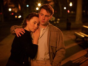 This photo provided by Fox Searchlight shows, Saoirse Ronan, left, as Eilis Lacey and Emory Cohen as Tony, in a scene from the film, "Brooklyn."  The movie opens in U.S. theaters on Nov. 4, 2015. (Kerry Brown/Fox Searchlight)