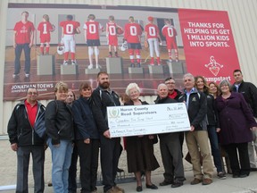 The 2015 AORS tradeshow executive committee presented a cheque for $10,000 to the Goderich Canadian Tire Jumpstart program in memory of Roger Cunningham. HCRSA’s Sean Thomas and Chip Wilson presented a cheque to Jumpstart regional manager Harry Bell along with Cunningham’s mother, Ila Cunningham. (Laura Broadley/Postmedia Network)