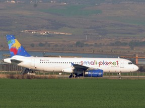 An Airbus A320-232, operated by charter firm Small Planet Airlines Poland, is seen in Burgas airport after it made an emergency landing following a bomb threat en route from Warsaw to Egypt, in Bulgaria, on Nov. 19, 2015. (REUTERS/Bulphoto Agency)
