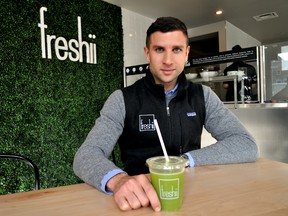 Matthew Corrin, founder and CEO of Freshi, enjoys a beverage before the grand opening of the company’s first location in London Ont. November 18, 2015. CHRIS MONTANINI\LONDONER\POSTMEDIA NETWORK