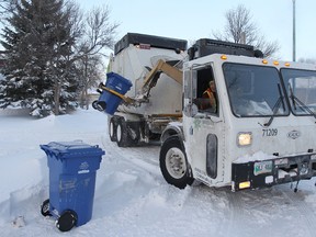 Garbage and recycling collection could be moved to front streets for those who have gravel back lanes. (KEVIN KING/Winnipeg Sun files)