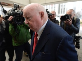 Senator Mike Duffy makes his way to the courthouse as his trial resumes Thursday November 19, 2015 in Ottawa. THE CANADIAN PRESS/Adrian Wyld