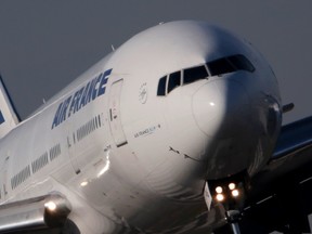 An Air France Boeing 777 aircraft lands at the Charles de Gaulle International Airport in Roissy, near Paris, October 27, 2015. REUTERS/Christian Hartmann